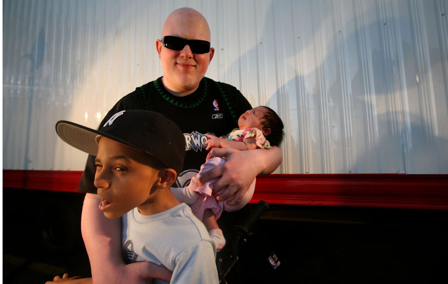 Brother Ali held his son, Faheem, and his newborn girl, Soul, backstage at Soundset.