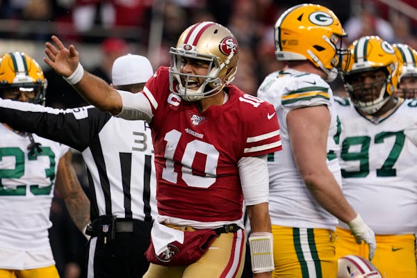 San Francisco 49ers quarterback Jimmy Garoppolo celebrates after converting a first down against the Packers during the NFC Championship Game