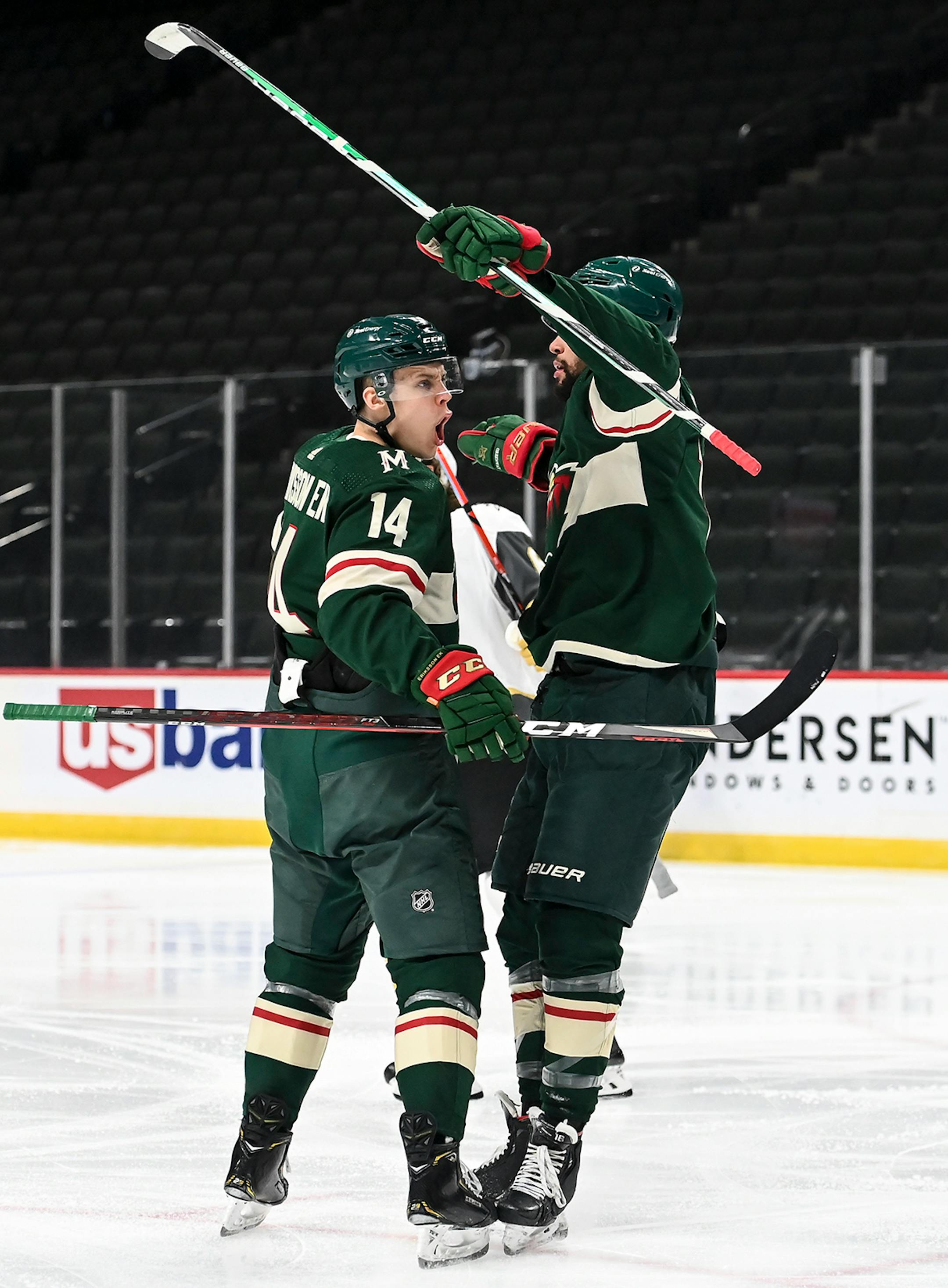 Minnesota Wild center Joel Eriksson Ek (14) and left wing Jordan Greenway (18) celebrated a goal by Eriksson Ek in the first period against the Vegas Golden Knights.