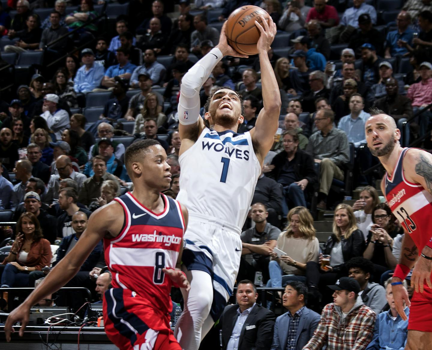 Minnesota Timberwolves' Tyus Jones (1) attempts a shot while being defended by Washington Wizards' Tim Frazier (8) in the first quarter on Tuesday, Nov. 28, 2017 at Target Center in Minneapolis, Minn. (Carlos Gonzalez/Minneapolis Star Tribune/TNS)