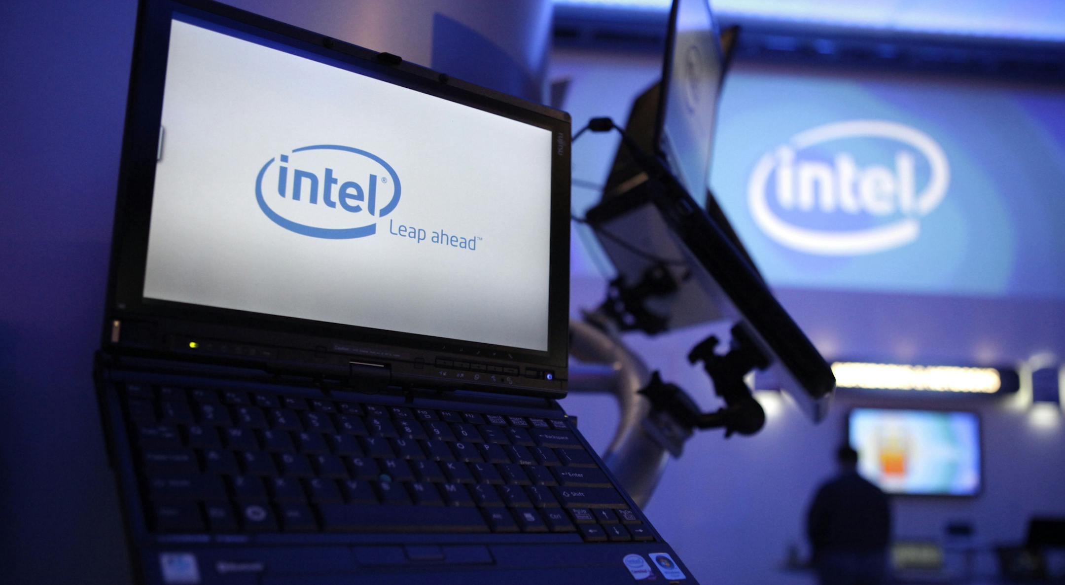 ** FILE ** In this Jan. 7, 2009 file photo, Intel logos are seen at the International Consumer Electronics Show (CES) in Las Vegas. Intel Corp.'s fourth-quarter profit plunged 90 percent but still met Wall Street's subdued expectations Thursday, as the chip maker was hurt by wheezing PC sales that have crimped demand for microprocessors. Sales slumped 23 percent, in line with Intel's previous guidance. (AP Photo/Jae C. Hong) ORG XMIT: MIN2013041113334976