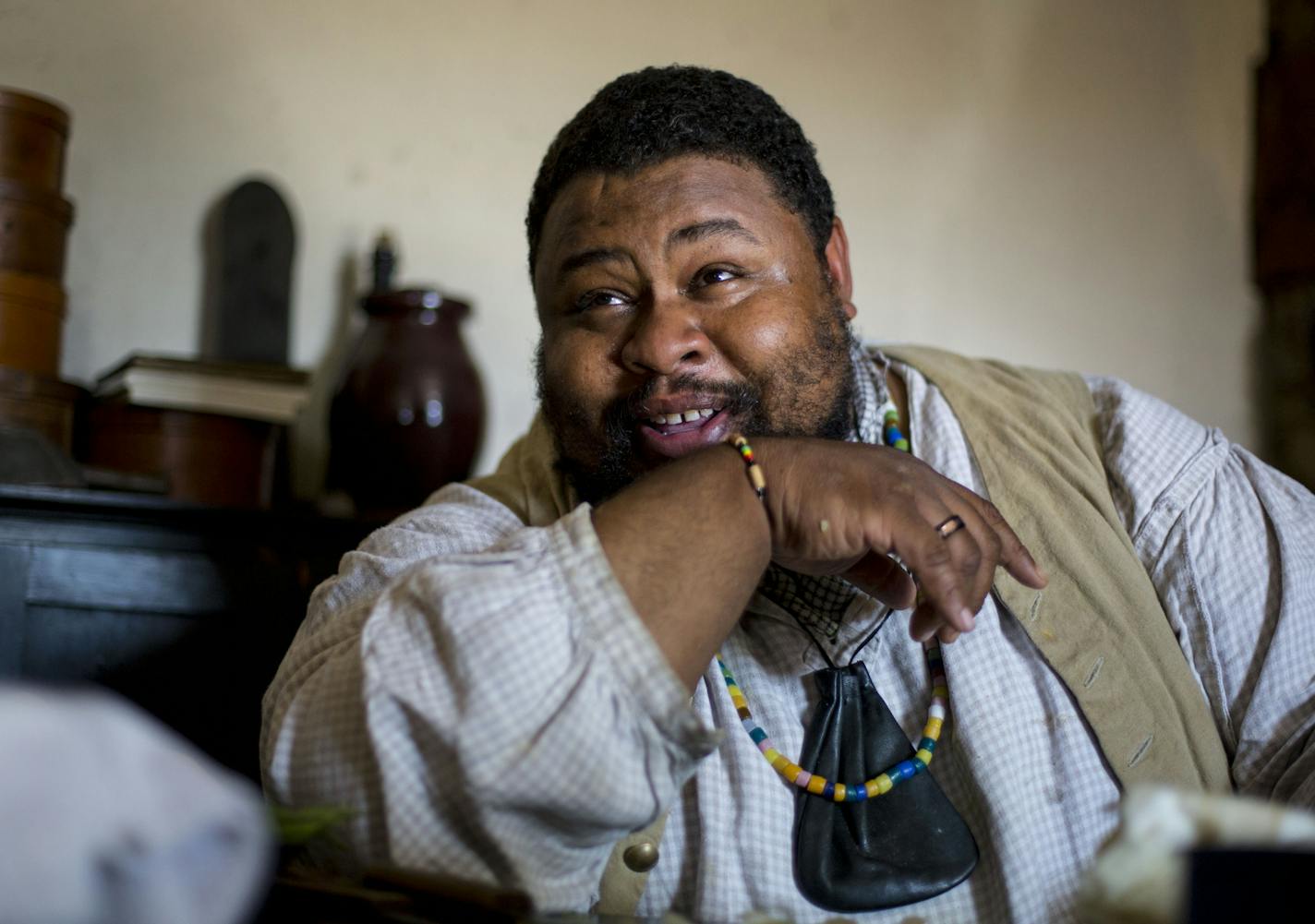 Michael Twitty laughs as he tells stories about his travels and experiences to the crowd. ] ALEX KORMANN &#x2022; alex.kormann@startribune.com Michael Twitty, a historian, chef and author spent the day at Fort Snelling in a kitchen once actually worked by slaves. He prepared traditional African meals that slaves often cooked for their masters in the 18th and 19th centuries in America. He spoke about the importance and traditions regarding food as well as the history behind it all.