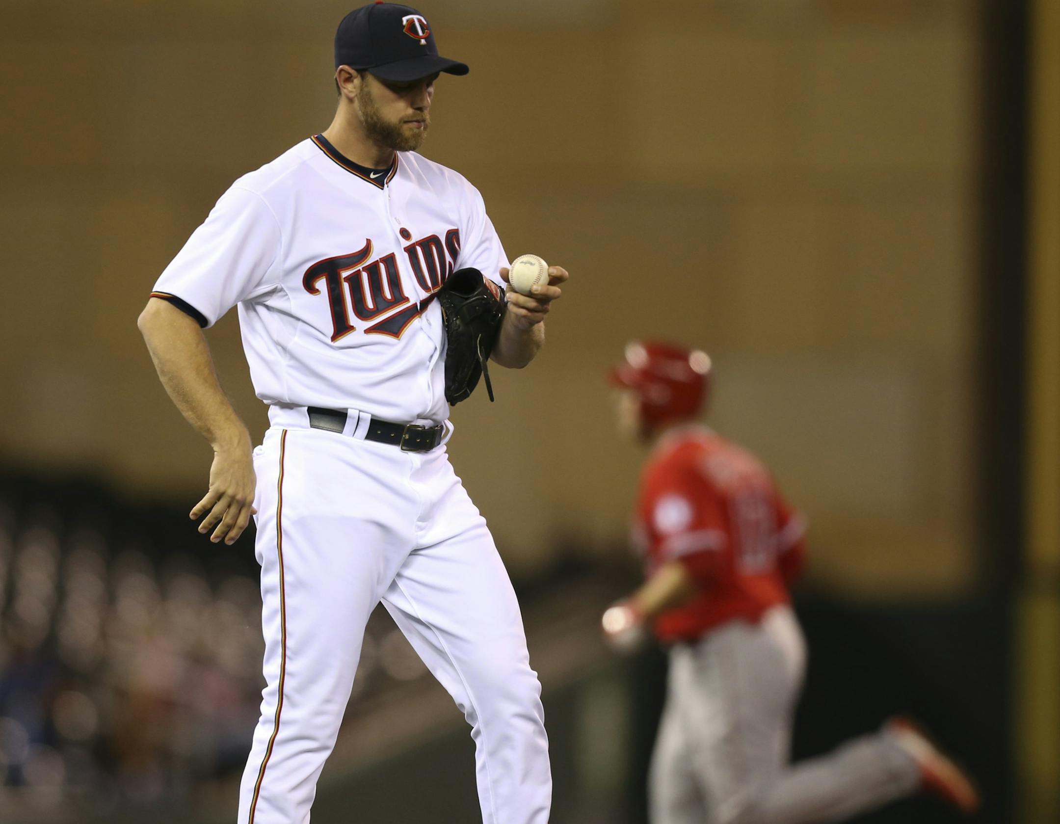 Los Angeles Angels catcher Chris Iannetta (17) hit a solo homer off Twins relief pitcher Neal Cotts (55) in the seventh inning for the Angels' 11th run Thursday night at Target Field. ] JEFF WHEELER ï jeff.wheeler@startribune.com The Twins lost 11-8 to the Los Angeles Angels in an MLB baseball game Thursday night, September 17, 2015 at Target Field in Minneapolis.