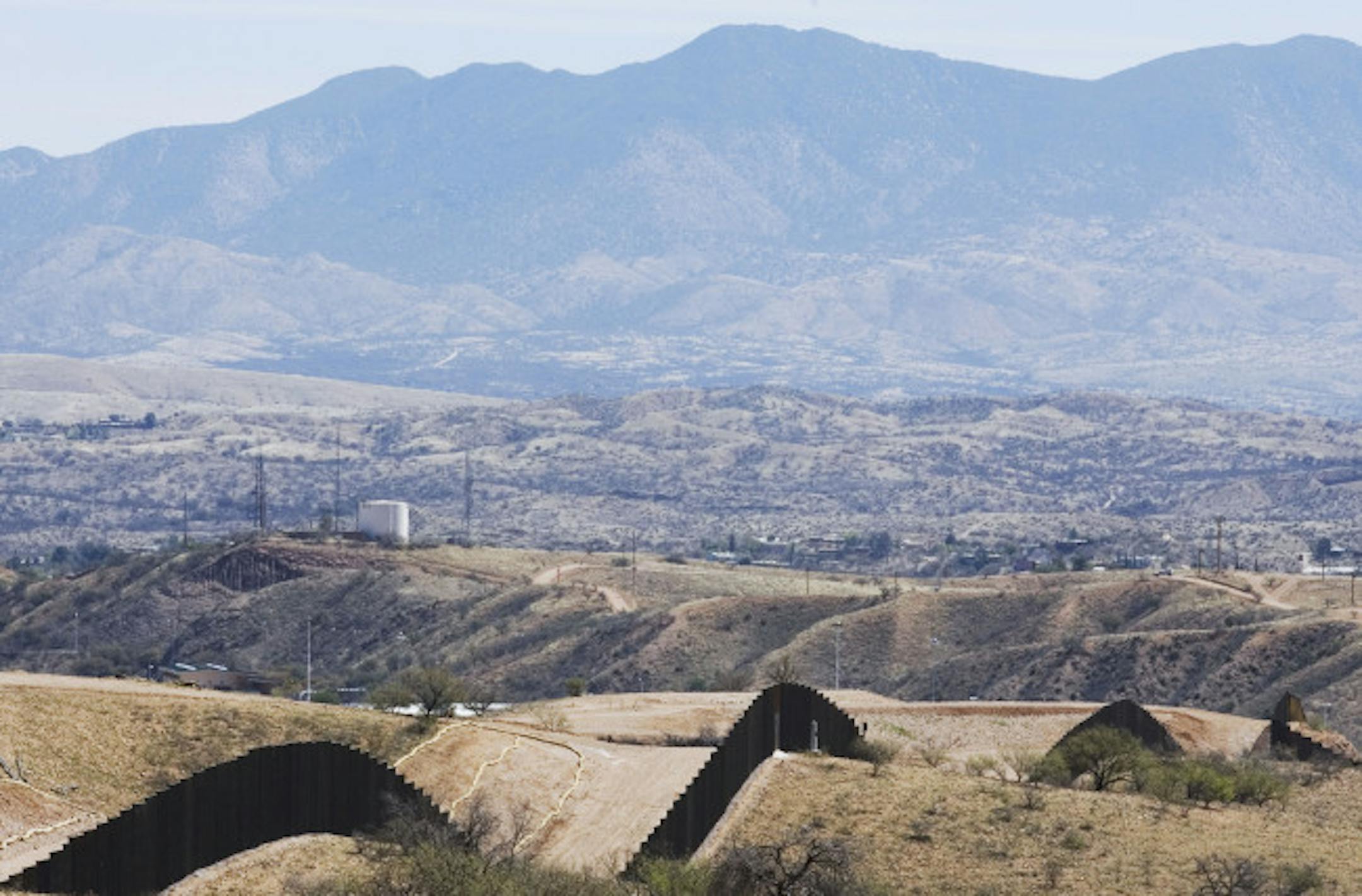 In a Tuesday, April 1, 2008 file photo, the U.S.-Mexico border fence is seen from the outskirts of Nogales, Mexico. The Supreme Court on Monday, June 23, 2008, turned down a plea by environmental groups to rein in the Bush administration's power to waive laws and regulations to speed construction of a fence along the U.S.-Mexican border.