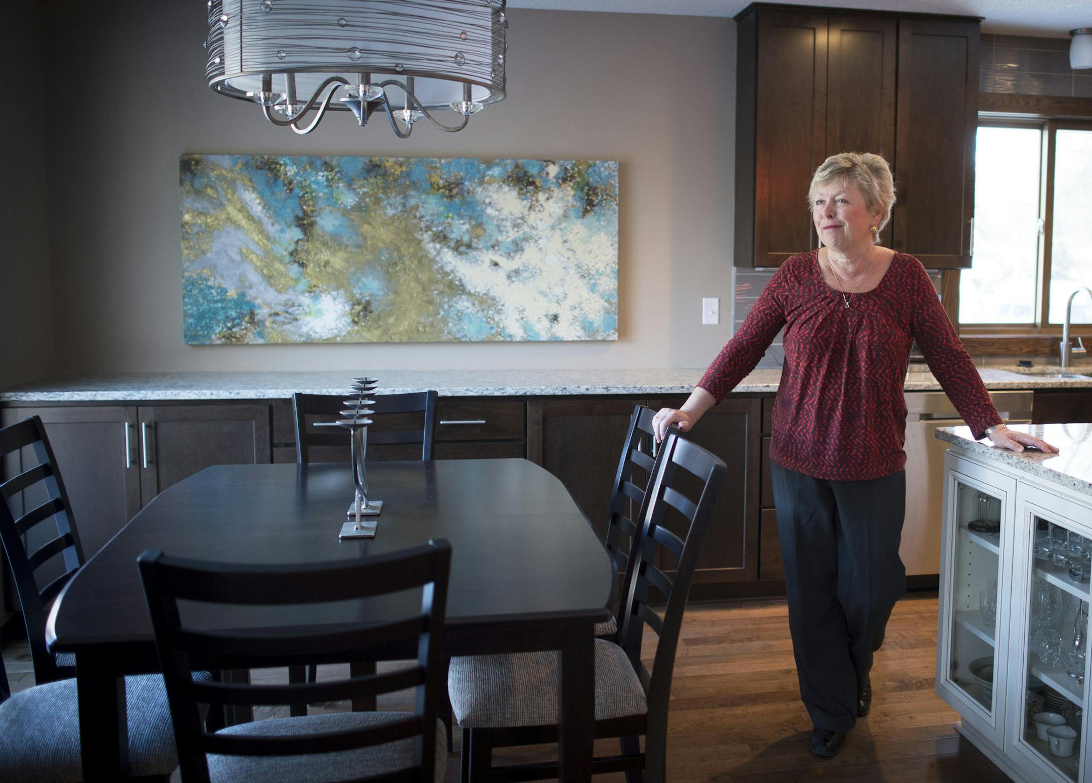 Jane Tatton stands in the dining area adjacent to her kitchen on Thursday afternoon. Just about everything in the upper level of her split home has been renovated including surfaces, cabinetry, ceilings, furniture and art. ] (Aaron Lavinsky | StarTribune) Split-level homes, popular during a certain era in the last century, are suddenly popular again, and selling especially well in inner-ring suburbs. Many cities, including Robbinsdale, Coon Rapids and Brooklyn Park, offer residents subsidies for