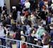 FILE - In this Sunday, Nov. 29, 2015, file photo, travelers line up at a security checkpoint area in Terminal 3 at O'Hare International Airport in Chi