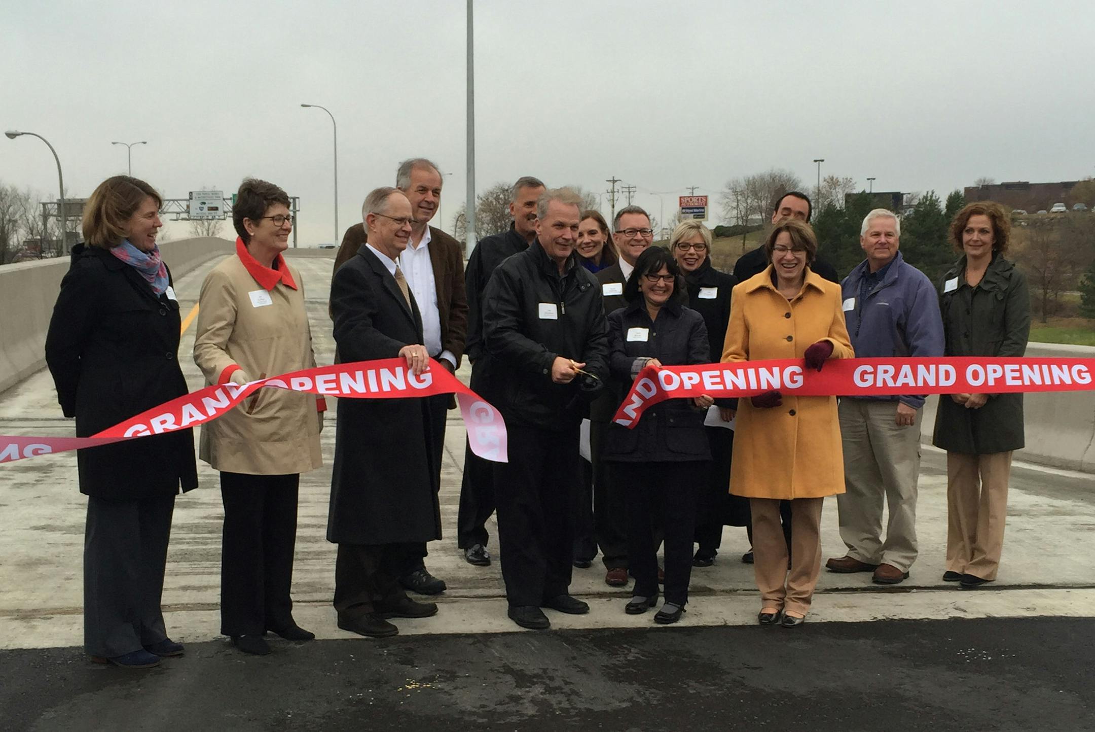 Local and state leaders celebrate the opening of the new westbound Interstate 394 ramp in Minnetonka on Nov. 5, 2014. Officials attending the event included U.S. Senator Amy Klobuchar, state Sen. Terri Bonoff, Hennepin County Commissioner Jan Callison, Minnetonka Mayor Terry Schneider, Minnetonka Councilmembers Patty Acomb,Tim Bergstedt and Bob Ellingson along with representatives and staff from other offices. The new ramp creates a full-access interchange that will relieve traffic congestion in