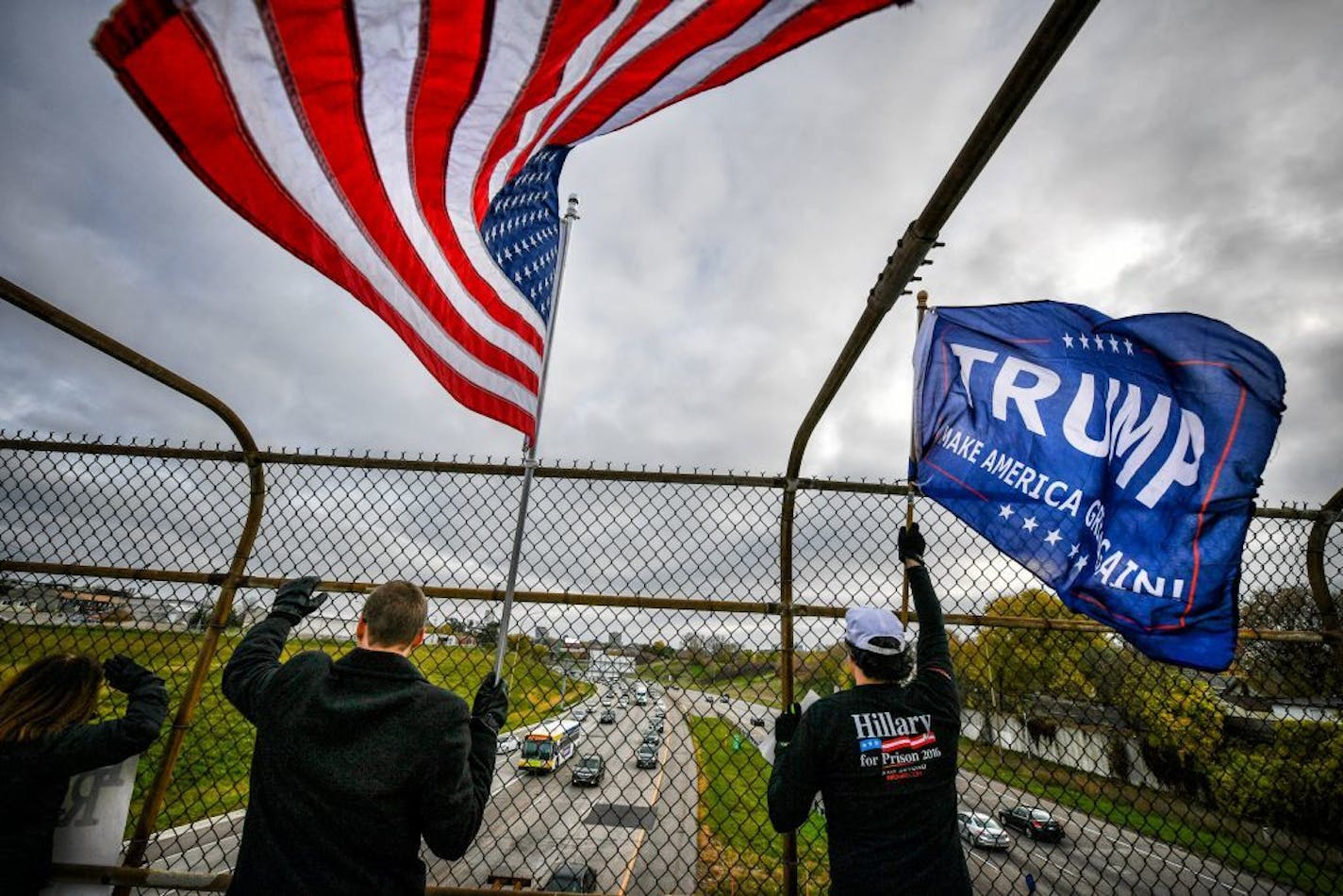 Minnesota Donald Trump supporters waved flags and banners from an overpass on I-35W in Northeast Minneapolis Thursday night.