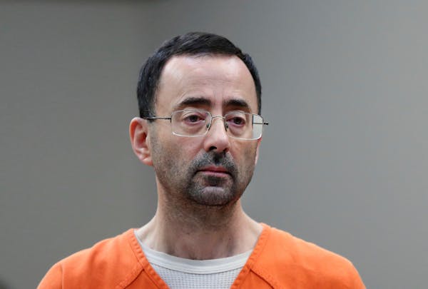 FILE - Dr. Larry Nassar, appears in court for a plea hearing on Nov. 22, 2017, in Lansing, Mich. The U.S. Justice Department said Thursday, May 26, 20
