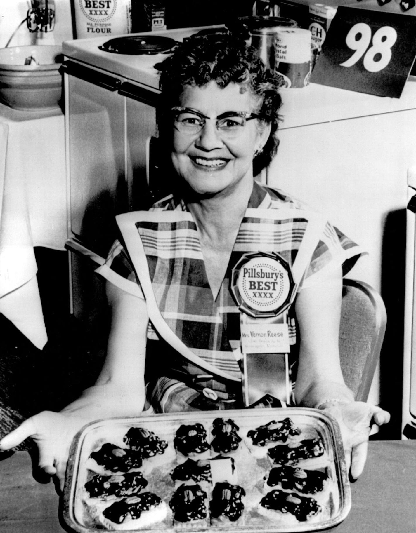 October 4, 1961 Mrs. Vernon Reese, Top Cook Displays winning candy cookies A Brooklyn Center home-maker waltzed through the ballroom of the Beverly Hilton hotel in Beverly Hills, Calif., Monday and Tuesday and came out with $25,000 for a batch of baking. Mrs. Vernon Reese, 5242 N. France Av., Brooklyn Center, won the top prize in Pillsbury's 1961 Grand National Bake-Off yesterday. Her Winning cookies, which her husband has never tasted, were "what I dreamed about one night." She used a regular r