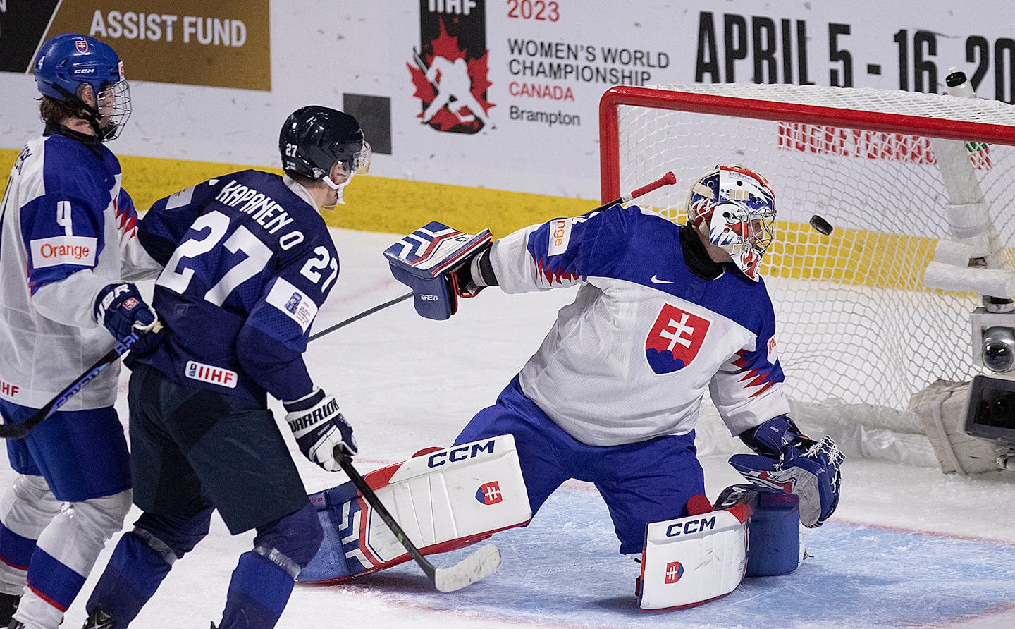 Slovakia goaltender Patrik Andrisik watches as the puck goes into the net as Slovakia's Maxim Strbak and Finland's Oliver Kapanen look on during the second period of an IIHF World Junior Hockey Championship hockey game in Moncton, New Brunswick, on Tuesday, Dec. 27, 2022. (Ron Ward/The Canadian Press via AP)