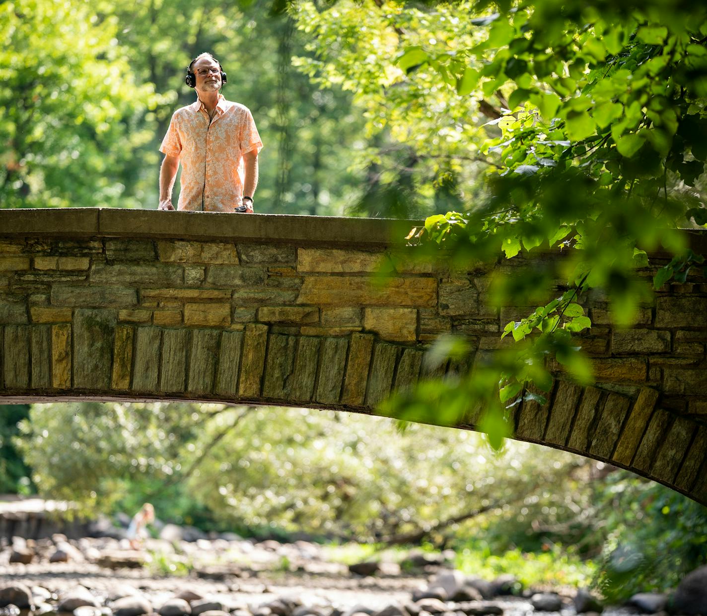 Composer Scott Miller posed for a portrait while listening to his "soundwalk" app at Minnehaha Falls. ] LEILA NAVIDI • leila.navidi@startribune.com