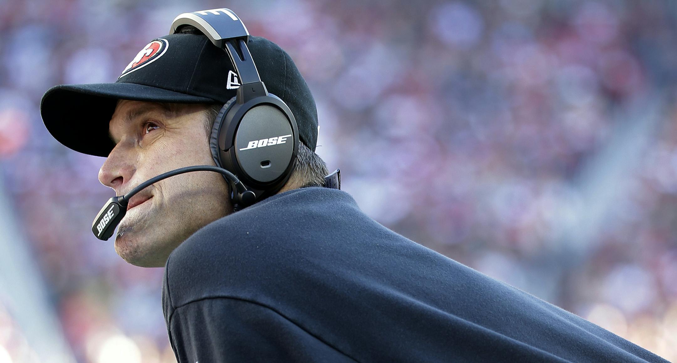 San Francisco 49ers head coach Jim Harbaugh watches from the sideline during the first quarter of an NFL football game against the Arizona Cardinals in Santa Clara, Calif., Sunday, Dec. 28, 2014. (AP Photo/Marcio Jose Sanchez)