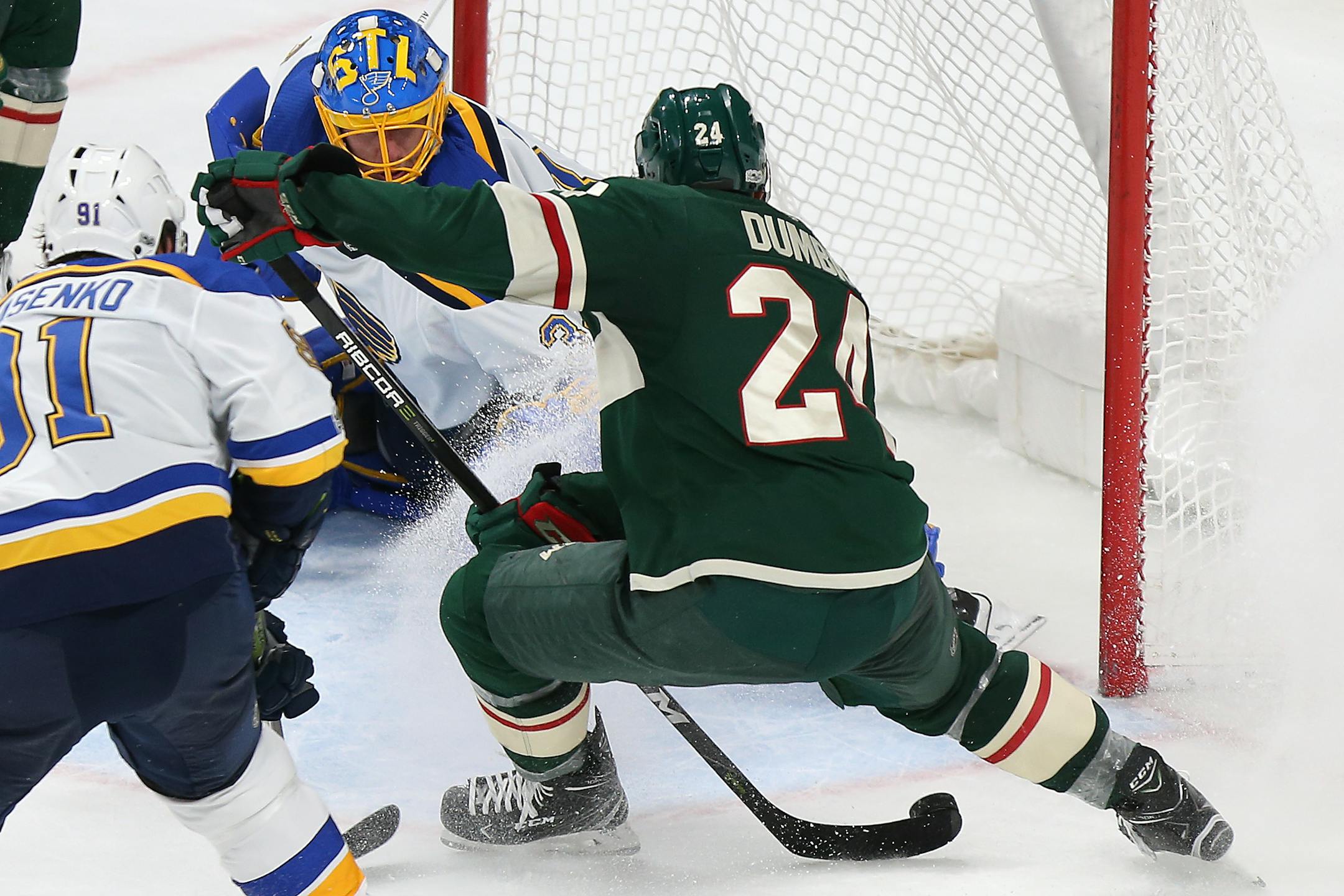 Minnesota Wild's Matt Dumba (24) lines up the game winning shot against St. Louis Blues' goalie Jake Allen (34) in overtime in an NHL hockey game Saturday, Dec. 2, 2017, in St. Paul, Minn. The Wild won 2-1. (AP Photo/Stacy Bengs)