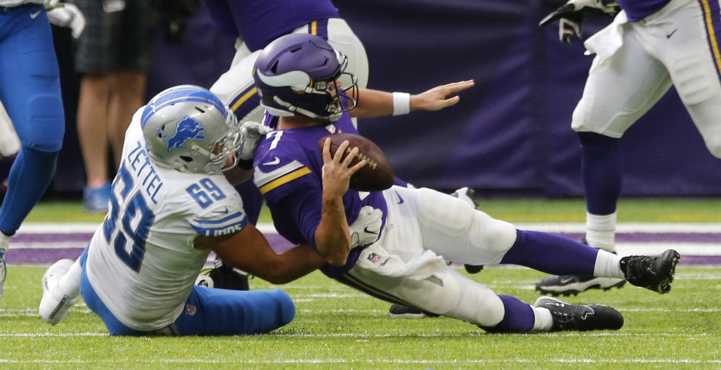 Detroit Lions defensive end Anthony Zettel (69) sacks Minnesota Vikings quarterback Case Keenum (7) during the second half of an NFL football game, Sunday, Oct. 1, 2017, in Minneapolis. (AP Photo/Jim Mone)