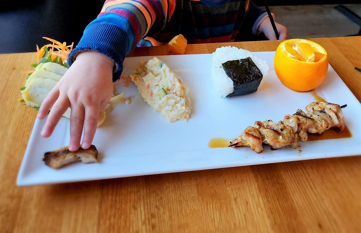 The kids combo at Kyatchi in Minneapolis comes with onigiri, tamago and Japanese potato salad