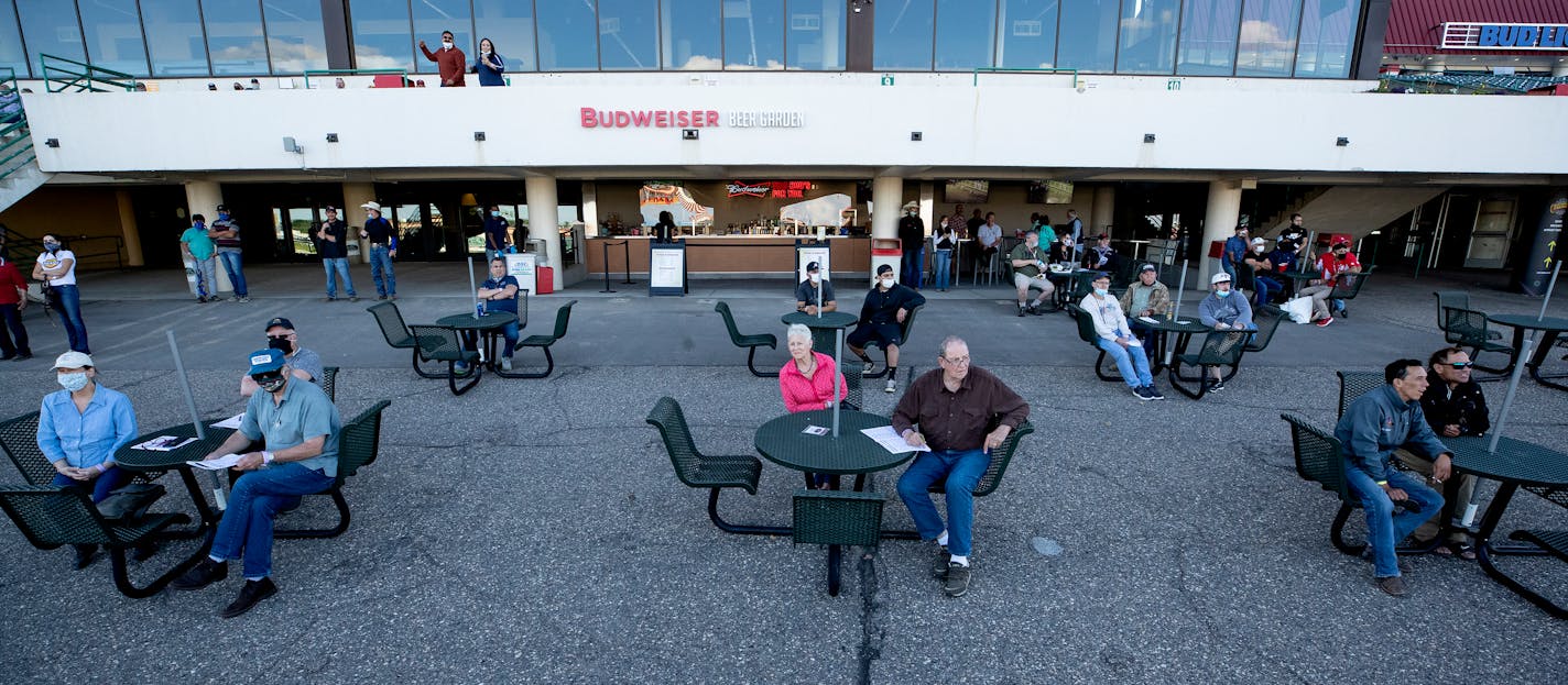 Owners and staff watched from the outside area on Wednesday at Canterbury Park. The public were allowed entry that was limited to 250 people with reservations on the third floor. ] CARLOS GONZALEZ ¥ cgonzalez@startribune.com Ð Shakopee, MN Ð June 10, 2020, Horse Racing begins at Canterbury Park