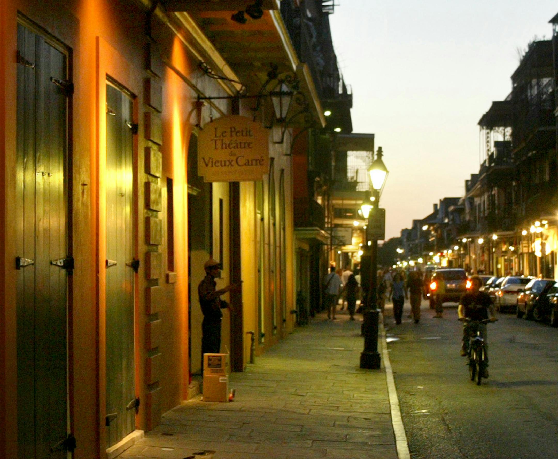 A night street scene in the French Quarter in New Orleans.