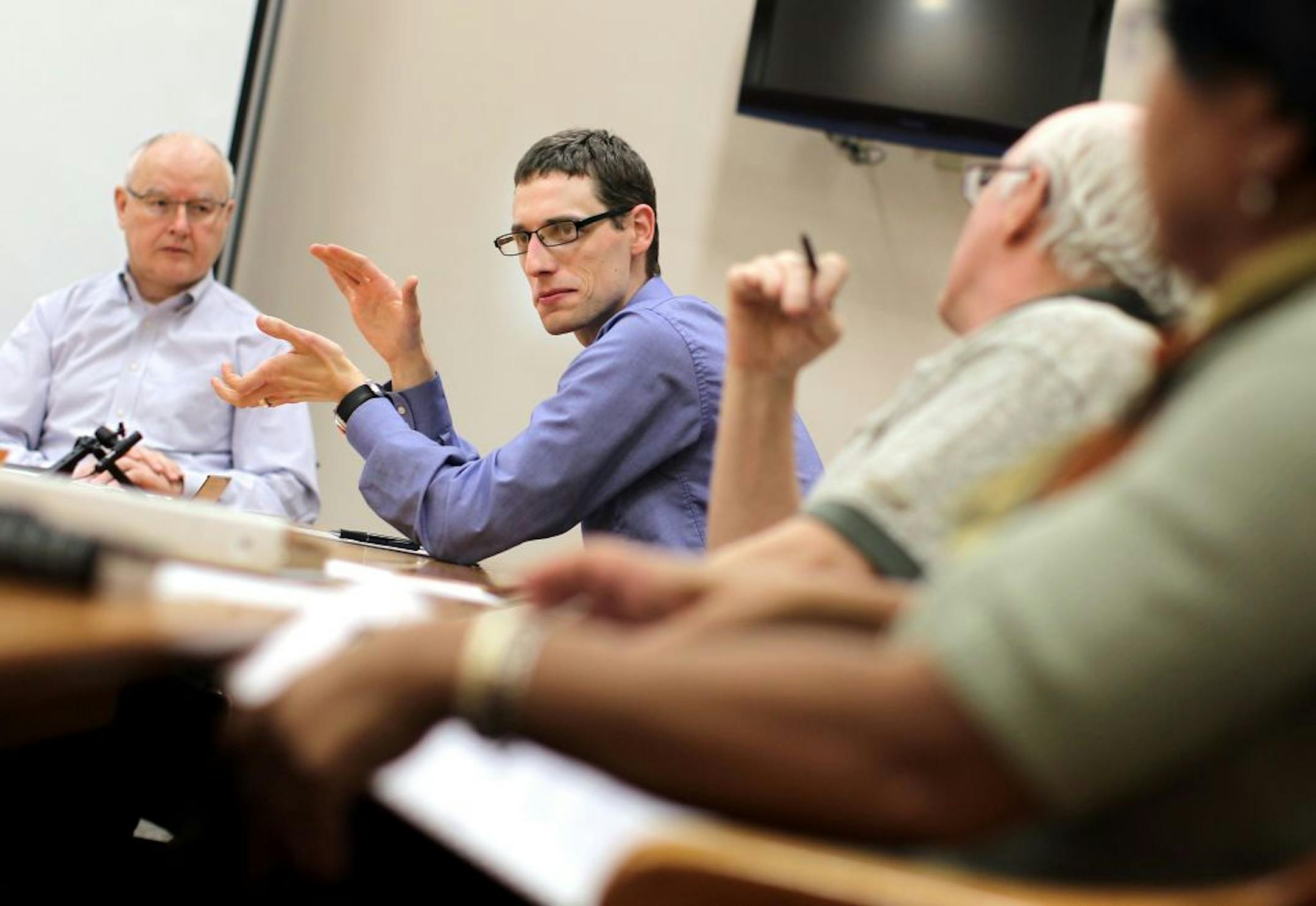 From left, Vernon Wetternach, Austen Zuege, Patrick Kvidera and Mary Pargo discussed the Minneapolis Civilian Police Review Authority's website during a monthly meeting at City Hall.