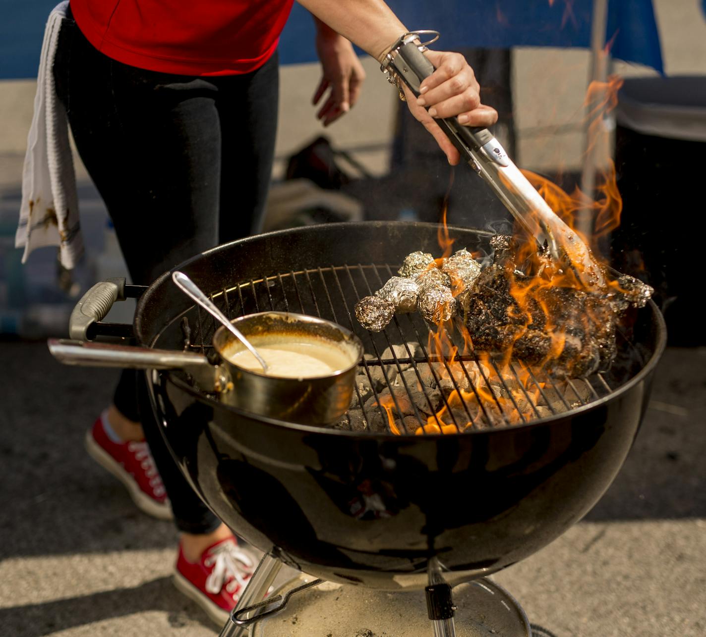 IMAGE DISTRIBUTED FOR KINGSFORD - Brooke Orrison-Lewis of The Shed Barbeque & Blues Joint prepares her Herbes de Provence Rack of Lamb with Shed Fig Sauce entry during Kingsford&#xed;s Girls that Grill Competition in the pursuit of being named the queen of &#xeb;cue on Friday, May 6, 2016 in Bentonville, Ark. (Gareth Patterson/AP Images for Kingsford)