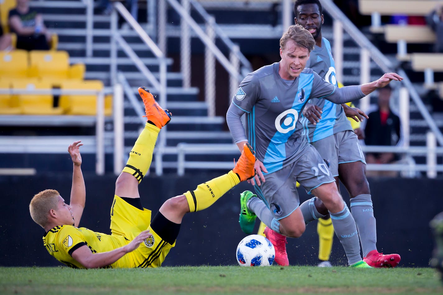 Minnesota United midfielder Rasmus Schuller (20) steals the ball from Columbus Crew midfielder Cristian Martinez (18) during the first half Saturday