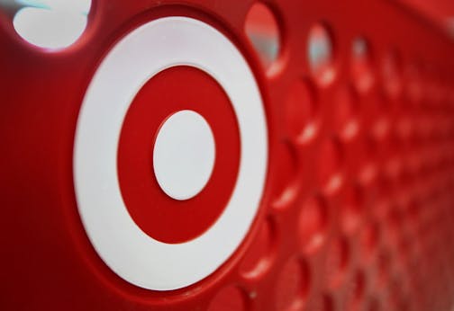 The Target Corp. logo is seen on a shopping cart at a store under construction in Chicago, Illinois, U.S., on Tuesday, May 15, 2012. Target Corp., the second-largest U.S. discount retailer, raised its full-year earnings forecast after warm weather helped drive sales in the first quarter. Photographer: Tim Boyle/Bloomberg *** Local Caption *** John Griffith