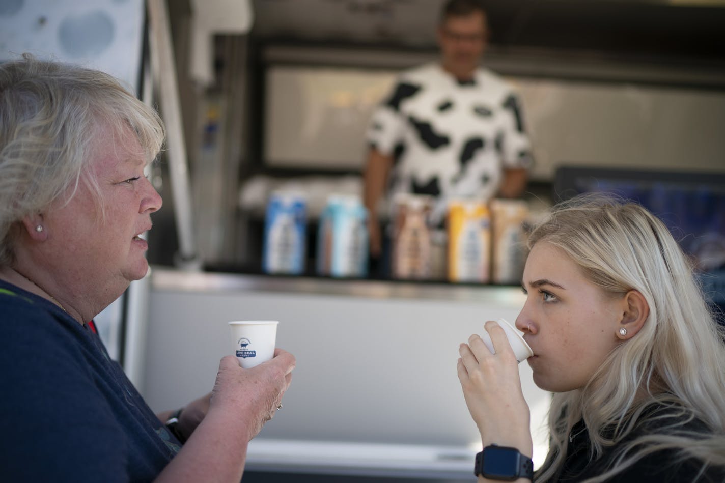 Kay Beaulieu and her granddaughter, Madison Deiman both sampled Live Real Farms' blended milk at the State Fair Wednesday afternoon. ] JEFF WHEELER &#x2022; jeff.wheeler@startribune.com Live Real Farms, a 100% farmer owned producer of a first-ever blended milk product that includes both lactose free dairy and plant-based beverages like almond or oat milk is launching the product with free samples and coupons from their stand at the Minnesota State Fair in Falcon Heights. Tyler Hatley was pouring