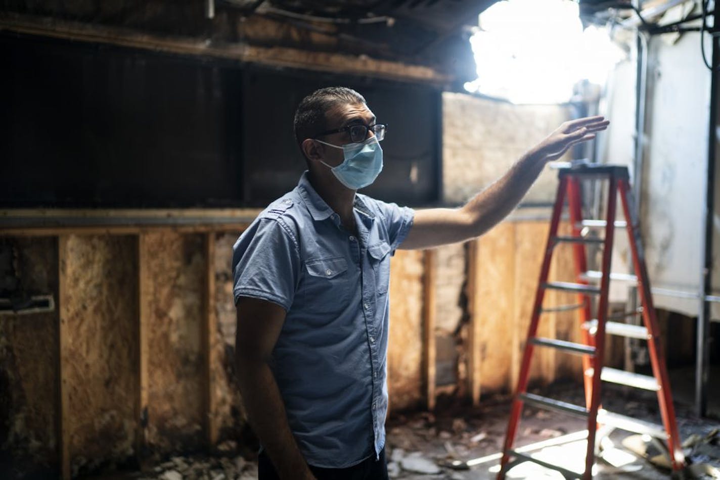 Dr. Ali Barbarawi stood in the rubble of his dental practice Chicago Lake Family Dental in Minneapolis, Minn., on Tuesday, June 2, 2020. This business was burned down by looters on Friday night. Rioters destroyed his $25,000 dental chairs and other expensive equipment, like a $90K extra-machine, before they set the place on fire.