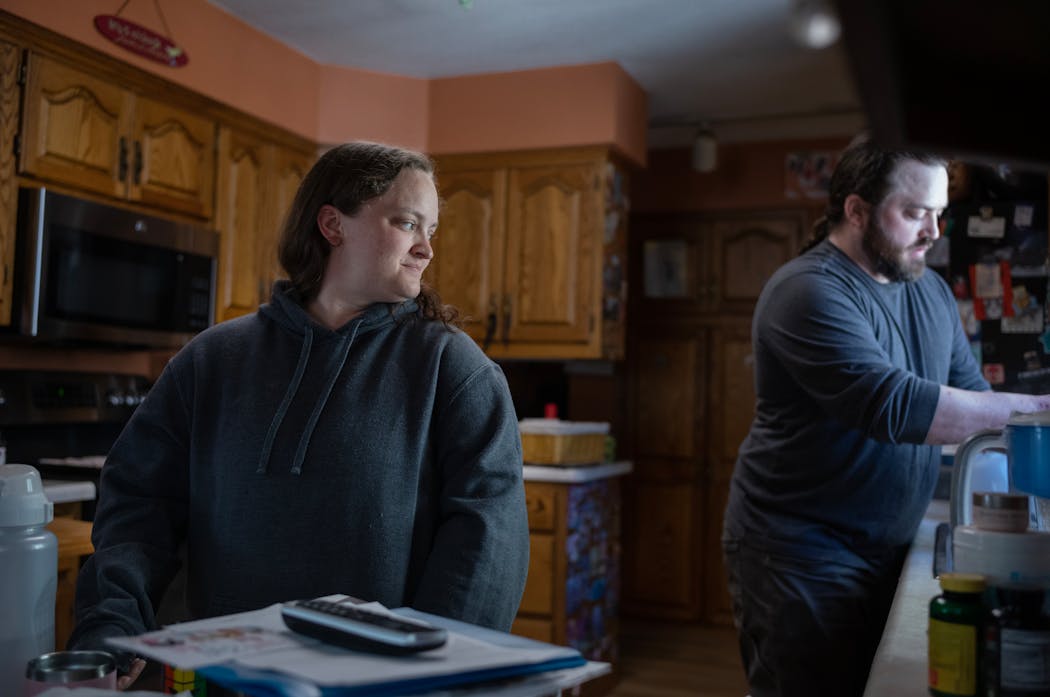Stephanie Clark stood in the family kitchen as her brother, Rob Clark, made chicken wings for lunch at the family home in Maple Grove on Wednesday.