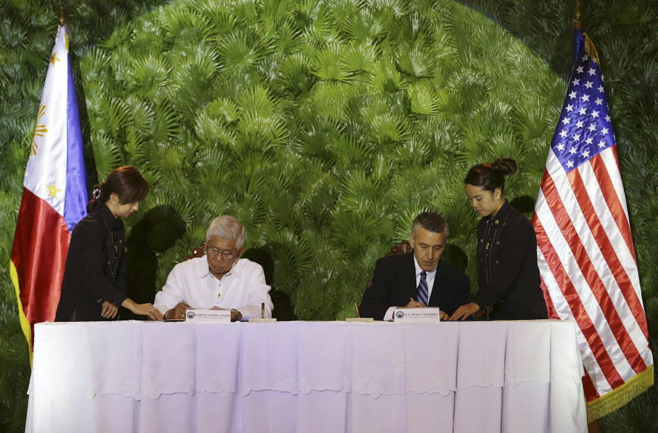 April 28, 2014: Philippine Defense Secretary Voltaire Gazmin, left, and U.S. Ambassador Philip Goldberg sign the Enhanced Defense Cooperation Agreement at Camp Aguinaldo, Philippine military headquarters in suburban Quezon city, north of Manila, Philippines.