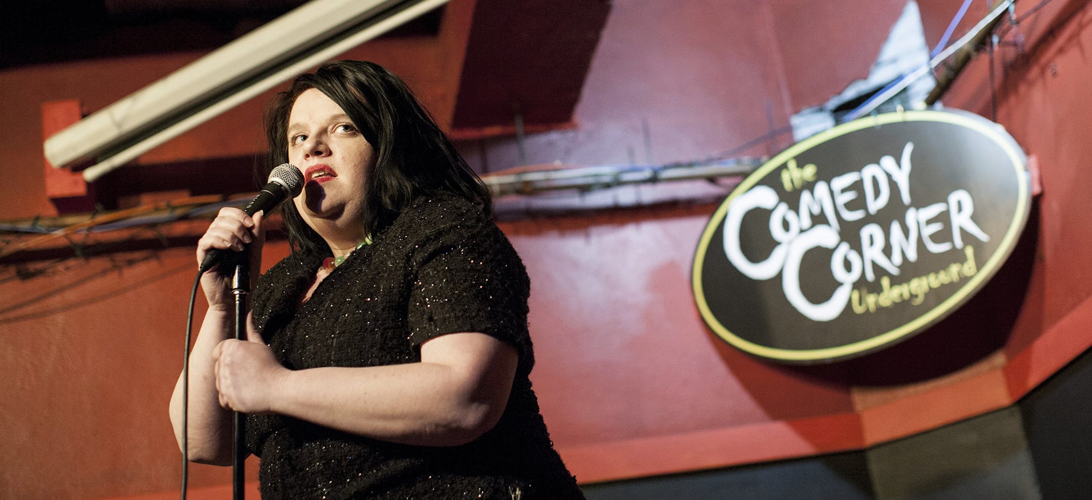 Comedian Rana May uses deadpan delivery to garner laughs during open mic night at Comedy Corner Underground in the basement of the Corner Bar in Minneapolis January 30, 2015. (Courtney Perry/Special to the Star Tribune)