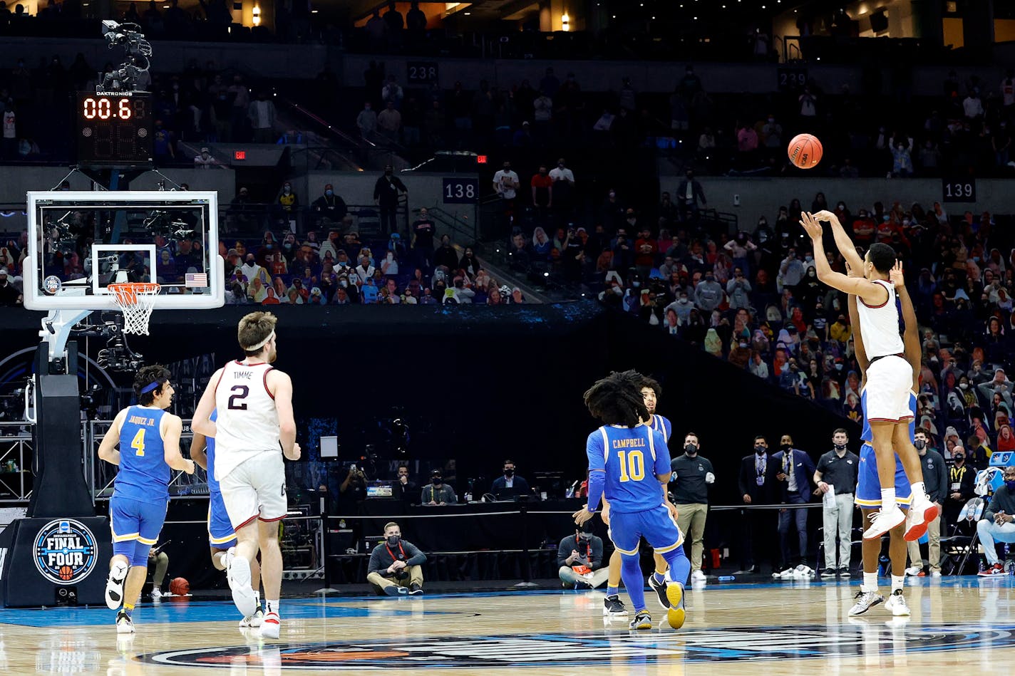 Jalen Suggs (1) of the Gonzaga Bulldogs shoots a game-winning three-point basket in overtime to defeat the UCLA Bruins 93-90 during the 2021 NCAA Final Four semifinal at Lucas Oil Stadium on April 03, 2021 in Indianapolis, Indiana. (Tim Nwachukwu/Getty Images/TNS) ORG XMIT: 12882505W