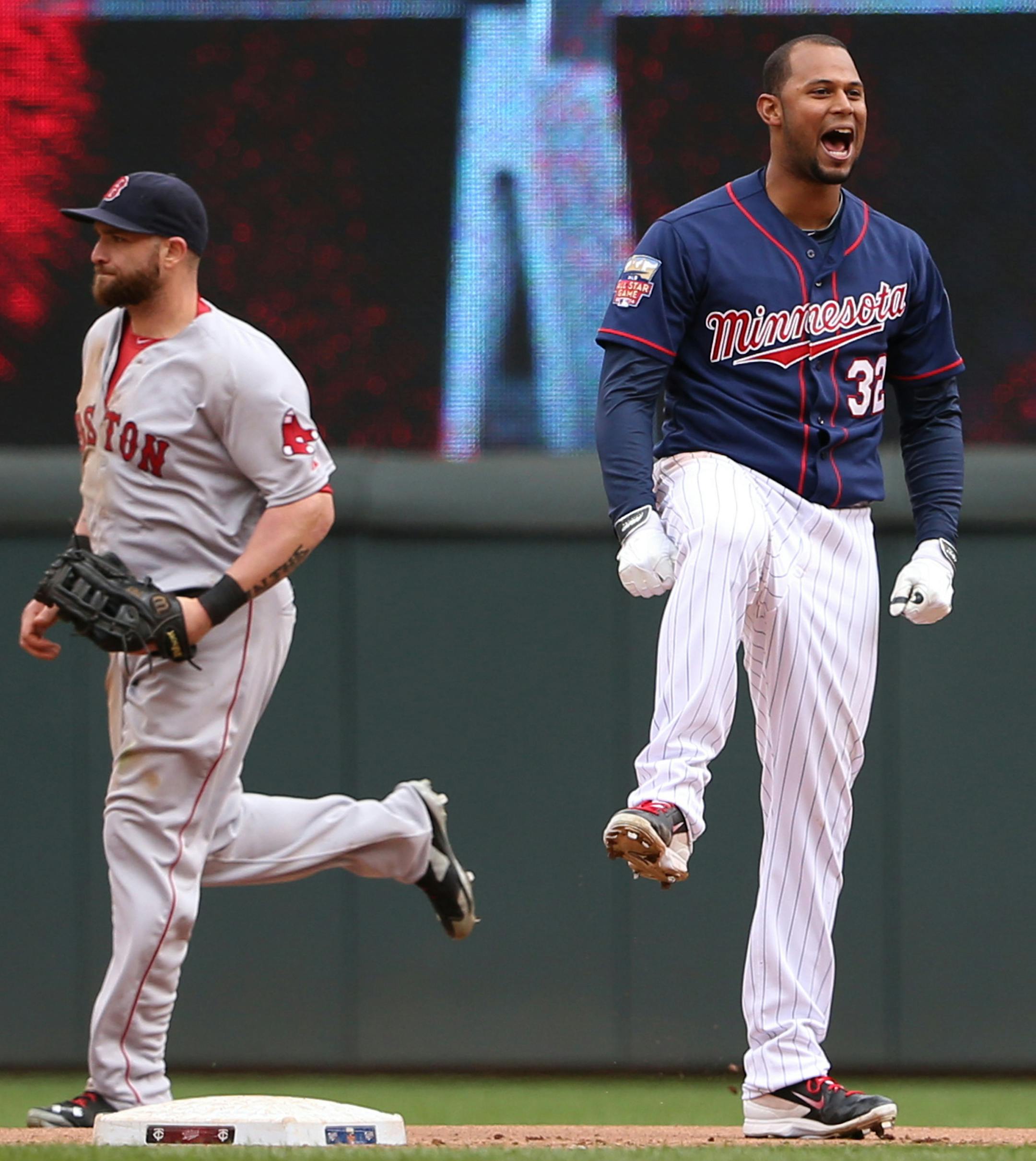 Twins Aaron Hicks celebrated after he drove in the winning run in the 10th inning.. ] (KYNDELL HARKNESS/STAR TRIBUNE) kyndell.harkness@startribune.com Twins won over the Boston Red Sox 4-3 in the 10th inning at Target Field in Minneapolis, Min. Thursday, May 15, 2014.