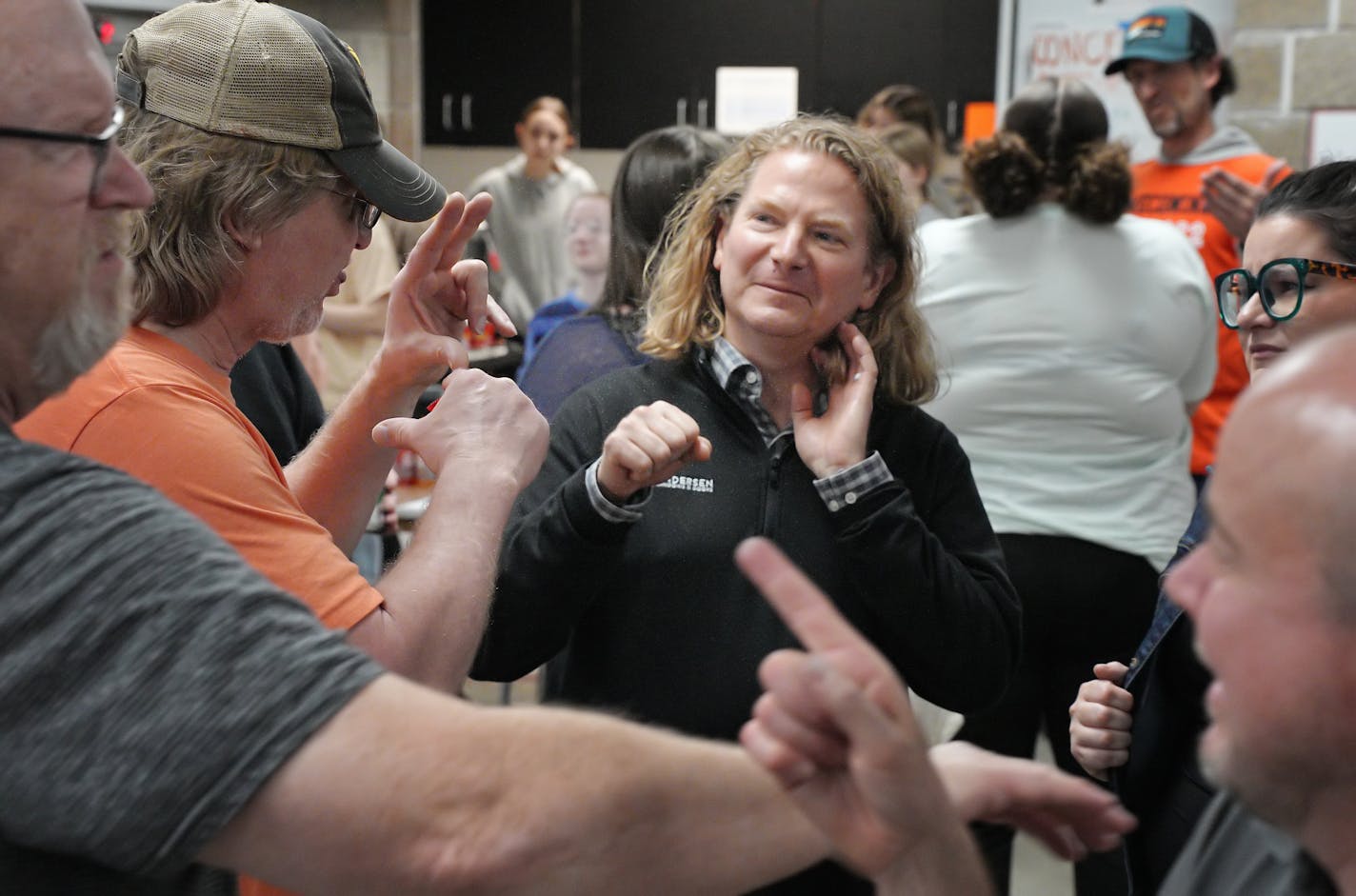 Mike Clark, IT director at Andersen Corp., chatted with folks at the Deaf, Culture &amp; Language Conference in White Bear Lake.