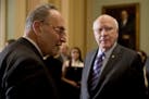 From left, Senate Minority Leader Sen. Chuck Schumer of N.Y., and Sen. Patrick Leahy, D-Vt., arrive for a news conference following a Senate policy lu