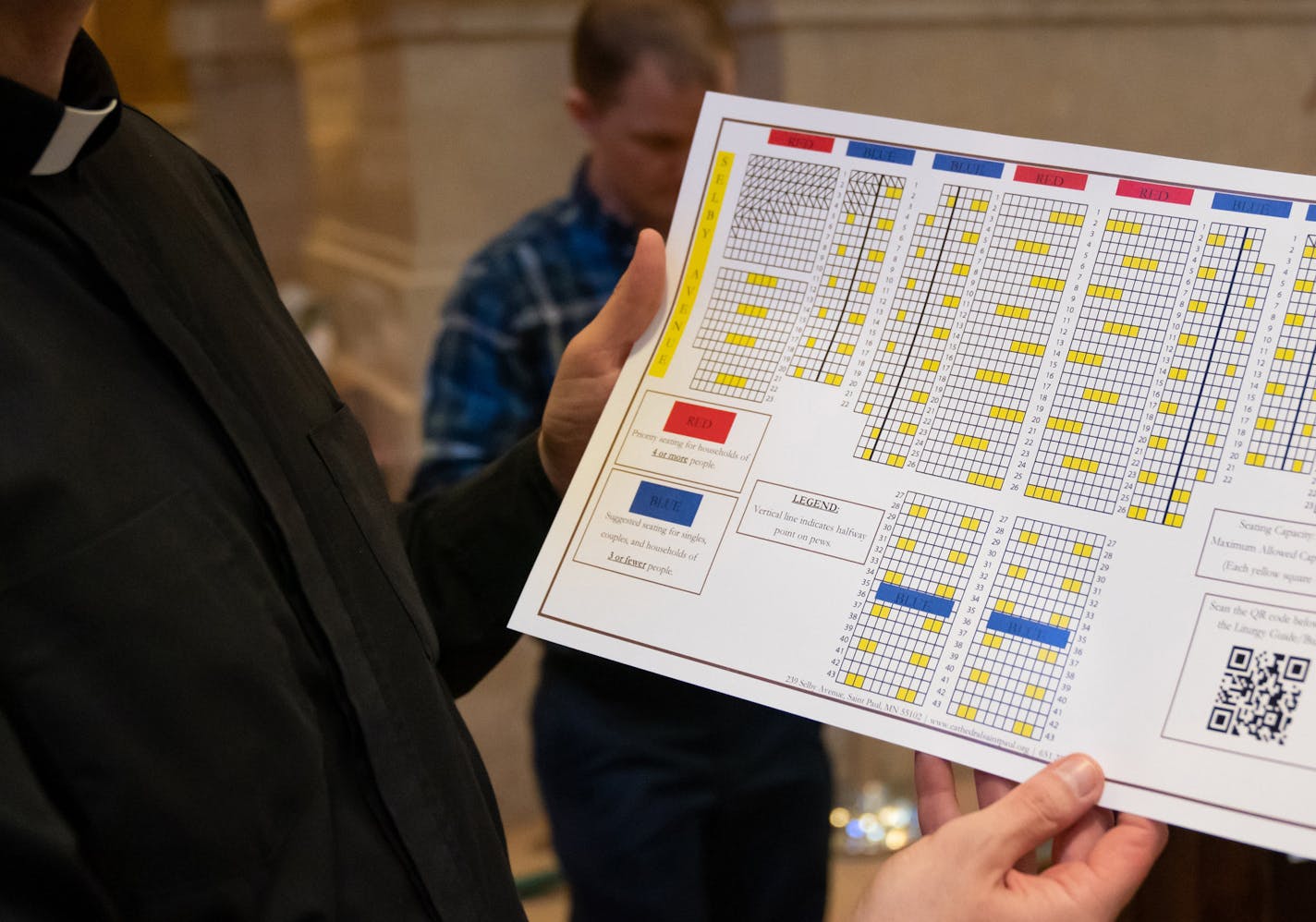 Fr. John Ubel roped off two pews, leaving every third one open according to a seating chart to evenly space 250 parishioners for this weekend's Mass at the Cathedral of St Paul. ] GLEN STUBBE • glen.stubbe@startribune.com Thursday, May 28, 2020 The Cathedral of St Paul is preparing to reopen for the first time since March. They're putting up signage and other safety precautions to comply with state health guidelines. They are roping off pews etc. Photo could be of news signs made that are not be