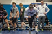 Wayzata High School wrestling coach Eric Swensen grew up in a wrestling environment that promoted unhealthy weight habits. He wants a different experi