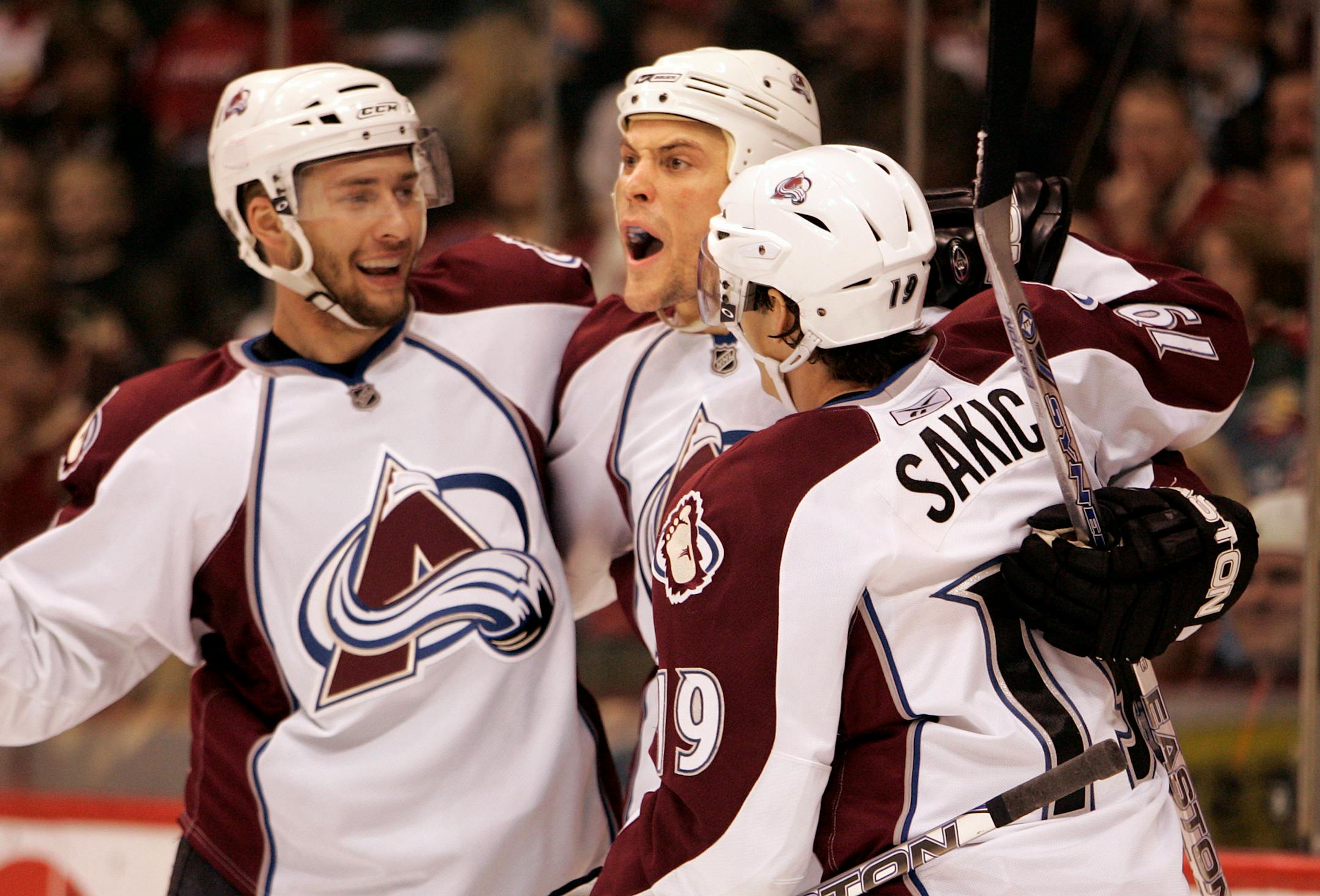 Kurt Sauer (middle) celebrated with teammates after scoring in the second period.