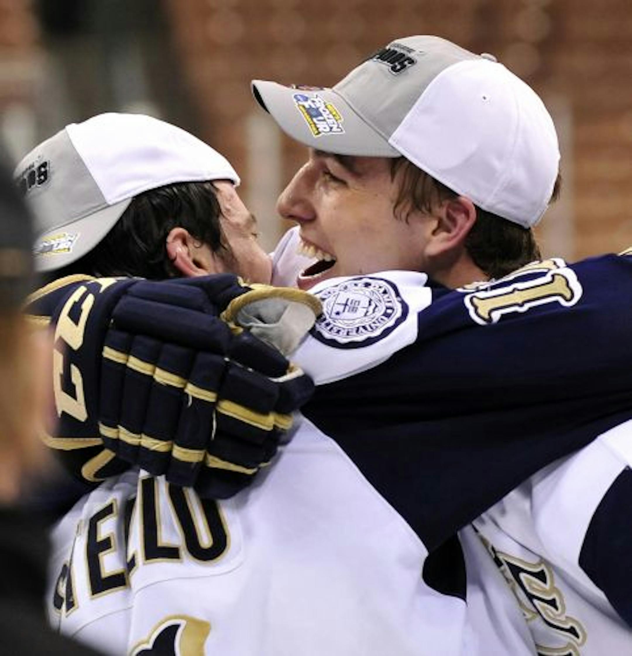 Notre Dame�s Jeff Costello, left, and Anders Lee celebrate following the Northeast regional final game against New Hampshire in the NCAA college hockey tournament in Manchester, N.H., Sunday, March 27, 2011. Notre Dame won 2-1 and will play Minnesota-Duluth in the Frozen Four in St. Paul, Minn.