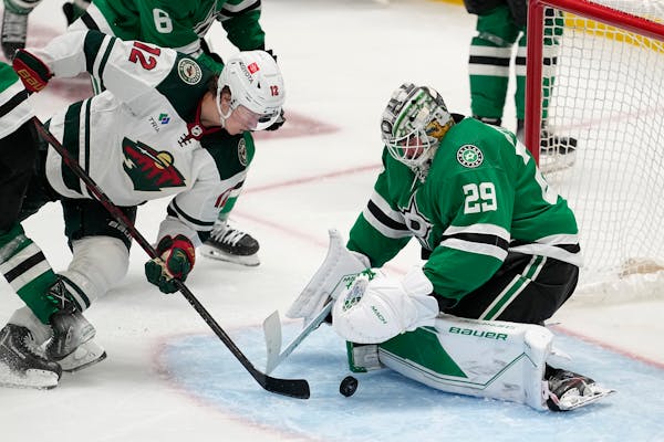 Minnesota Wild left wing Matt Boldy (12) attempts to get a shot past Dallas Stars goaltender Jake Oettinger (29) in the third period of Game 2 of an N