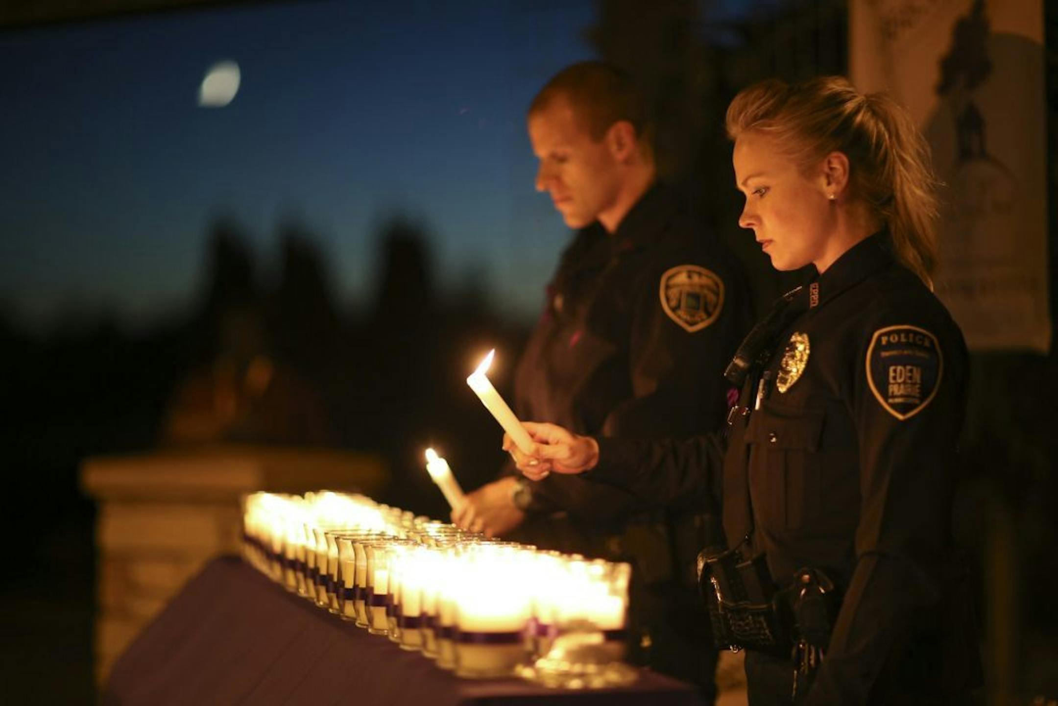 A vigil, organized by Cornerstone as part of Domestic Violence Awareness Month, was held Monday evening, October 7, 2013 at Purgatory Creek Park in Eden Prairie. Names were read and a candle was lit to honor each of the 38 deaths related to domestic violence in the state so far this year. The first name read was of Mandy Matula, 24, of Eden Prairie, who disappeared five months ago. She was last seen with her ex-boyfriend, who later killed himself. Eden Prairie Police Officer Erica Coy and Brookl