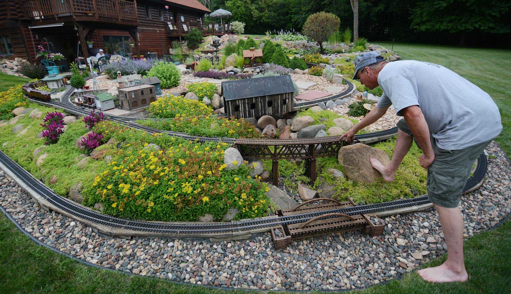 Jim Shaver checked his garden railway at his home in Mound. &#x201c;It&#x2019;s never done,&#x201d; Shaver said. &#x201c;It&#x2019;s a journey, not a destination.&#x201d;