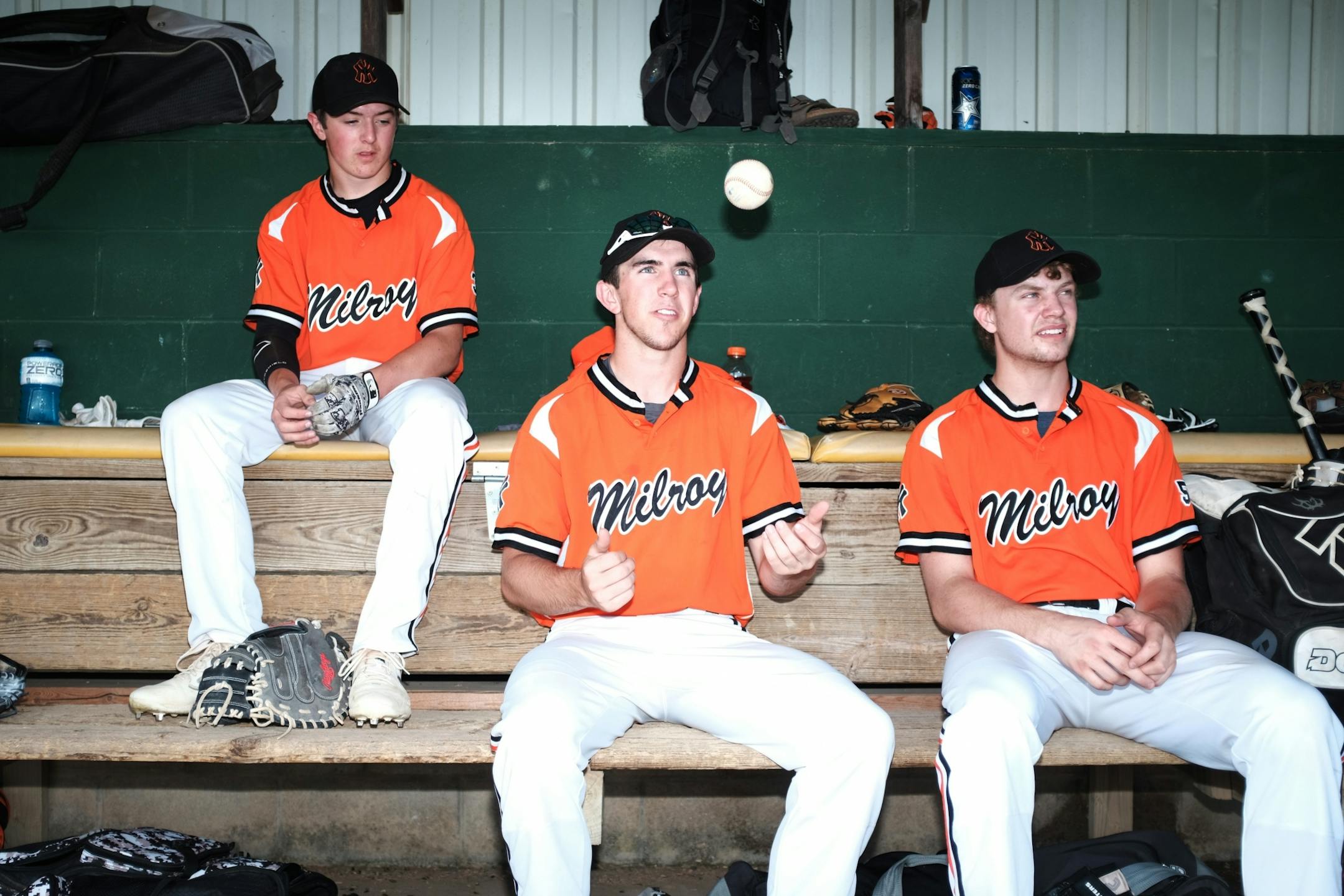 Yankee's Jacob Hughes, Jackson Hughes and CJ Theis kill time in the dugout before their game against Spicer and Yankee Field.