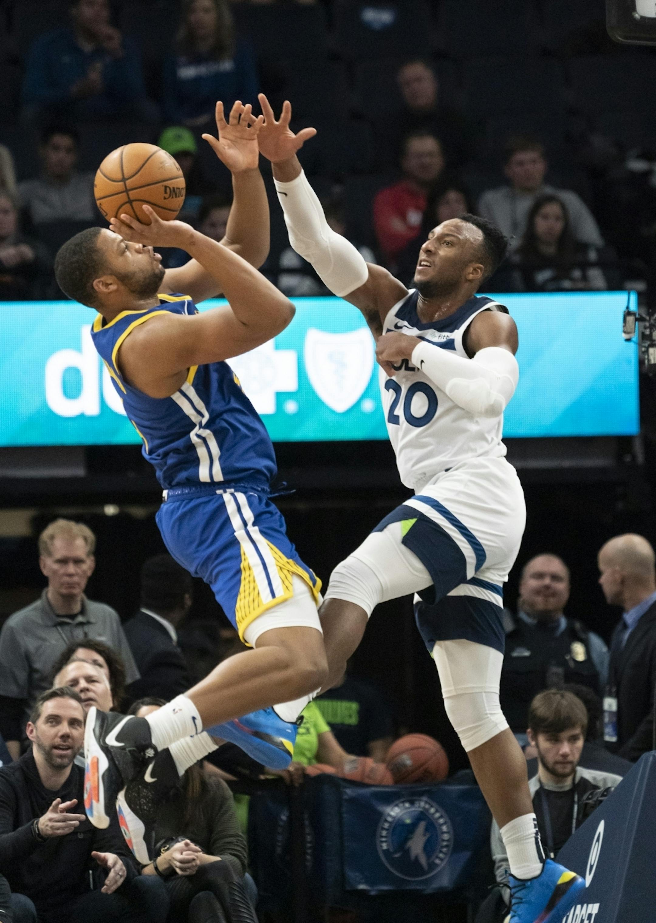 Minnesota Timberwolves guard Josh Okogie (20) tried to block a shot by Golden State Warriors forward Omari Spellman (4) in the second half.