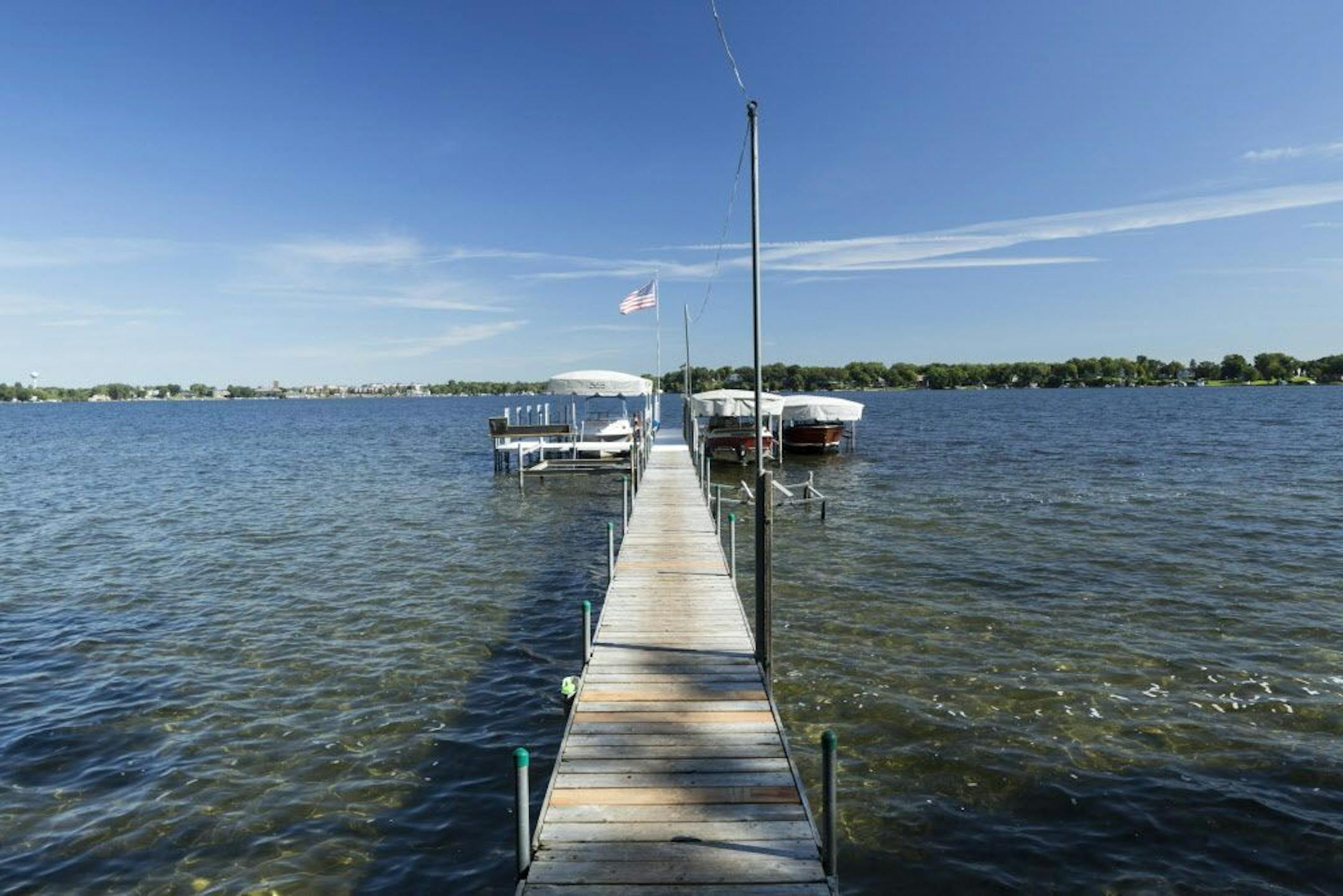 Spray Island, which is listed for $2.75 million, includes a five-bedroom home, guest cottage, and multiple docks for boats to travel across Lake Minnetonka to the mainland.