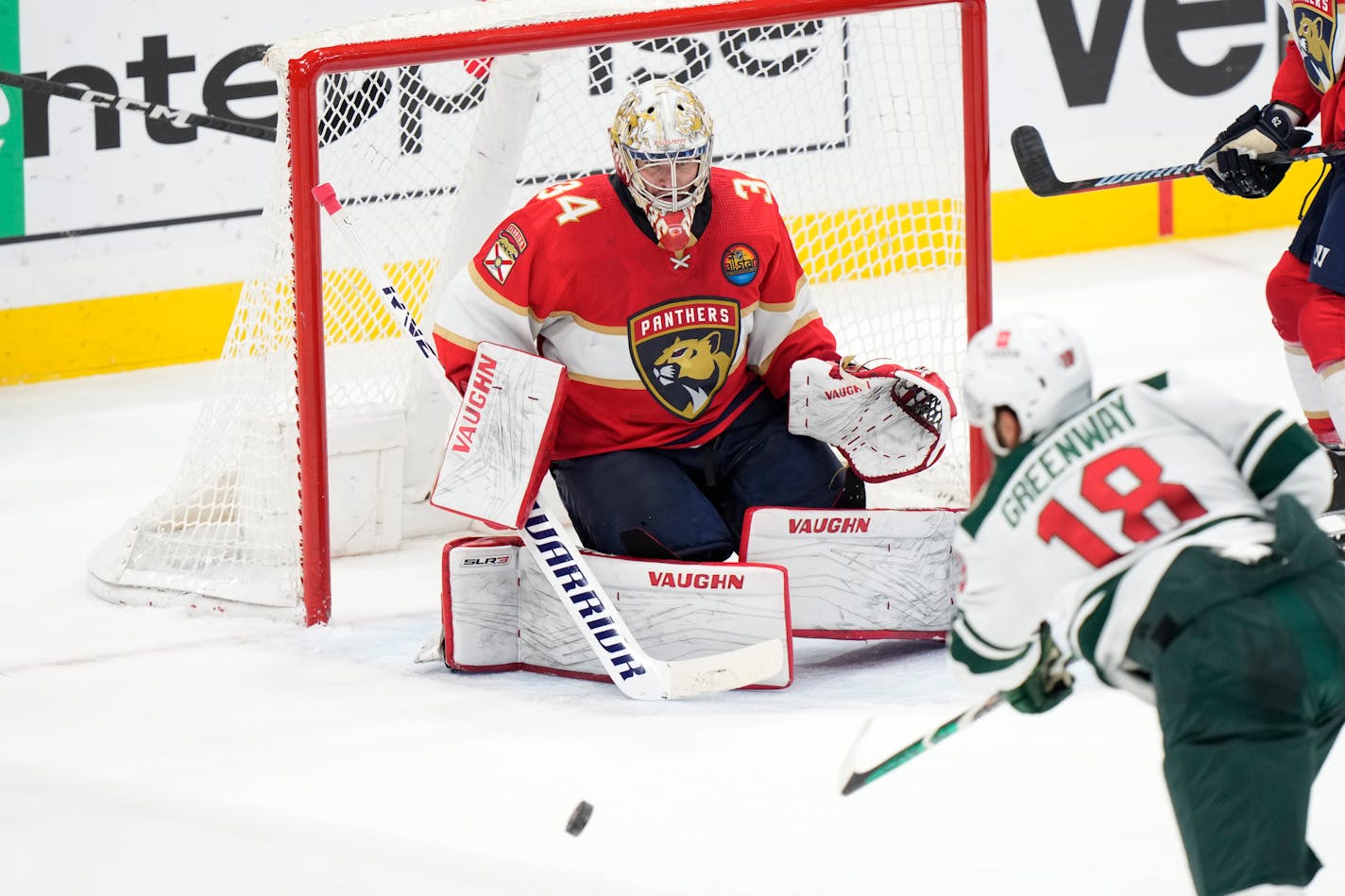 Minnesota Wild left wing Jordan Greenway (18) attempts a shot at Florida Panthers goaltender Alex Lyon (34) during the second period of an NHL hockey game, Saturday, Jan. 21, 2023, in Sunrise, Fla. (AP Photo/Wilfredo Lee)