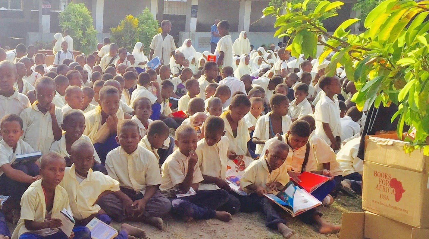 g BFA Founder Tom Warth walked across Zanzibar, an island off the coast of East Africa in Fenruary. As part of the walk, which was done to raise money for BFA and celebrate Warth's 80th birthday, he and others delivered books to schools.Here, children are reviewing books they've received. ORG XMIT: P36asRx4d-SRLW-tinJH