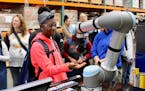 Kayla Pollard, a student at Minneapolis Roosevelt High School learned about robotics during a 2017 tour of Graco's Minneapolis facilities.
Photo: Grac