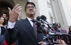 American Civil Liberties Attorney, Omar Jadwat, gestures as he speaks after a hearing before t the US Fourth Circuit Court of Appeals in Richmond, Va.