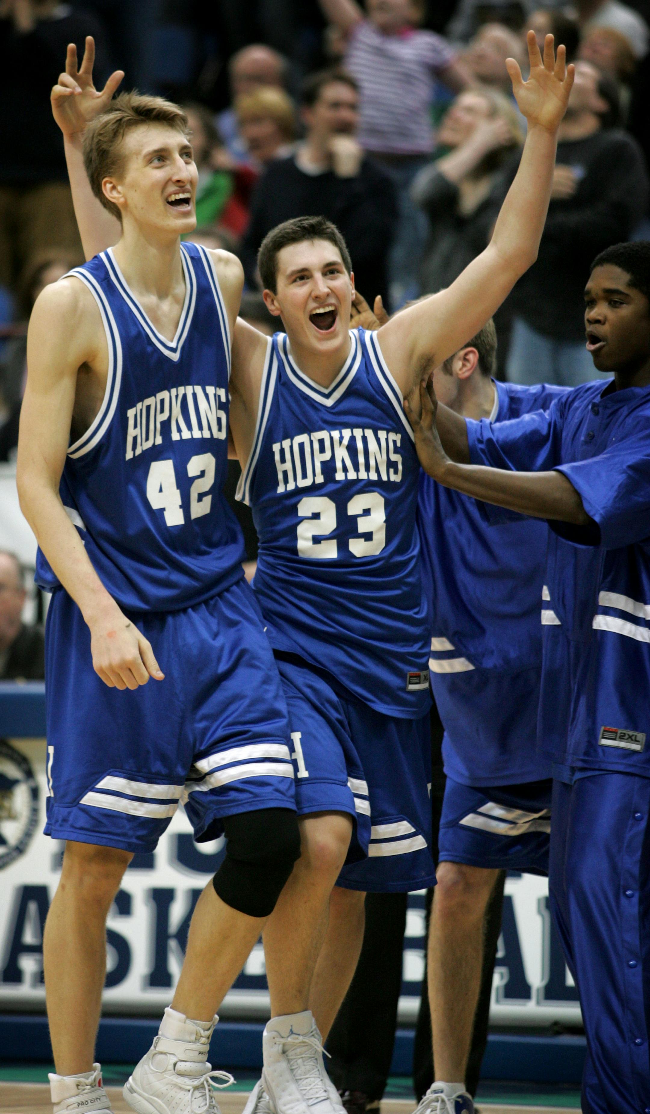 Jennifer Simonson/Star Tribune Minneapolis, MN-Sat., Mar. 19, 2005 Hopkins sophomore Blake Hoffarber (23) celebrates with teammate Arden Skoglund (42), a senior, after making a basket at the end of the first overtime to tie the game at 58. Hopkins defeated Eastview, 71-60, in two overtimes to win the Class 4A state championship.
GENERAL INFORMATION: Class 4A boys' state basketball championship with Hopkins v. Eastview.